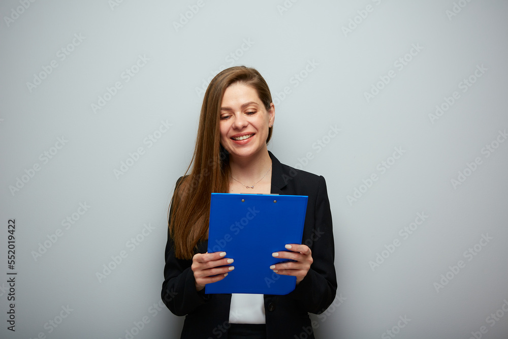 Smiling business woman holding clipboard tablet. Isolated portrait with copy space. Smiling business woman holding clipboard tablet. Isolated portrait with copy space.