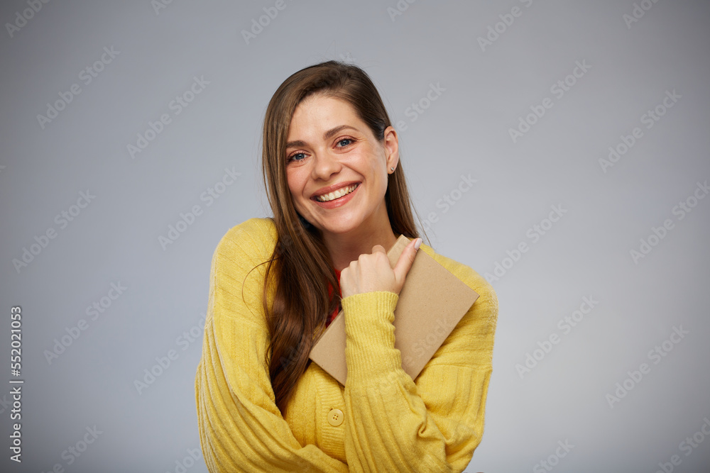 Smiling college student holding book. Advertising female portrait. Smiling college student holding book. Advertising female portrait.