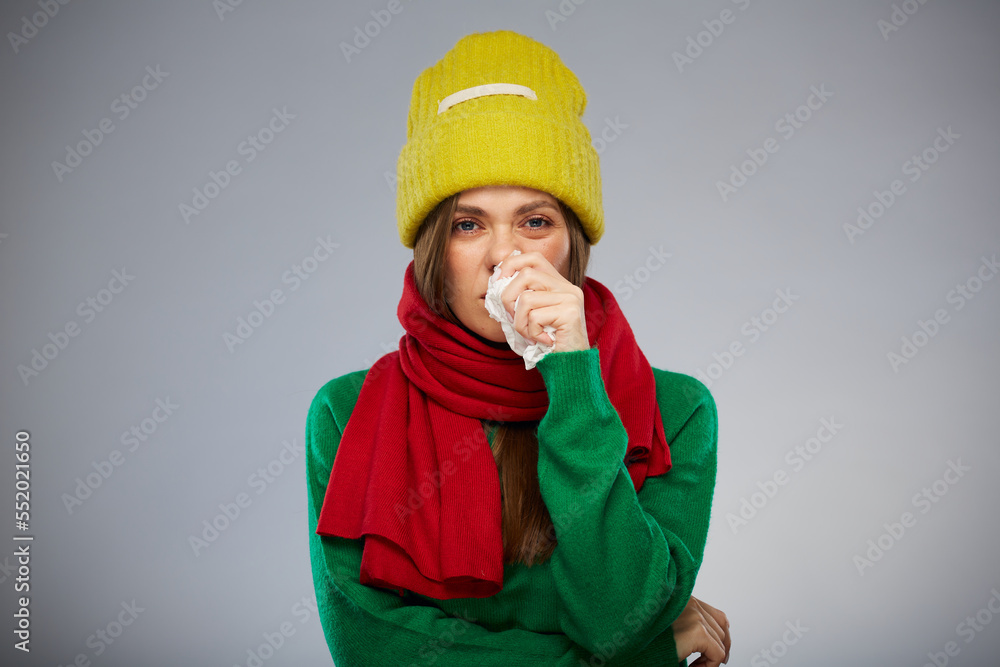 Sick woman using tissue for runny nose isolated portrait. Sick woman using tissue for runny nose isolated portrait.
