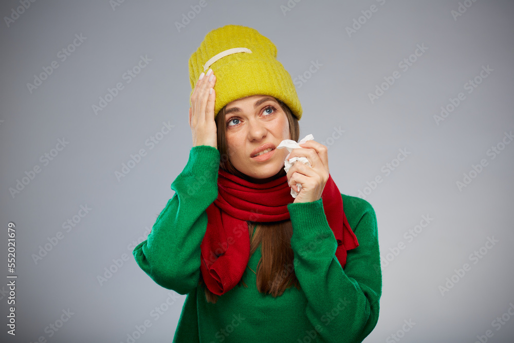 Sick woman in yellow hat touching her head with headache isolated portrait. Sick woman in yellow hat touching her head with headache isolated portrait.