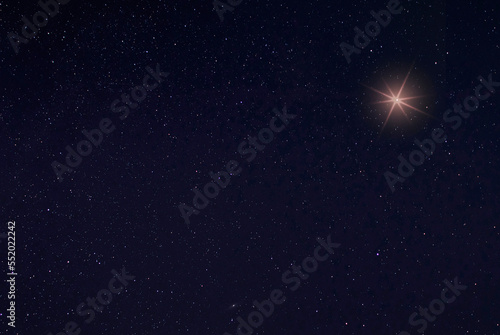 Single bright star in the sky on Christmas Eve