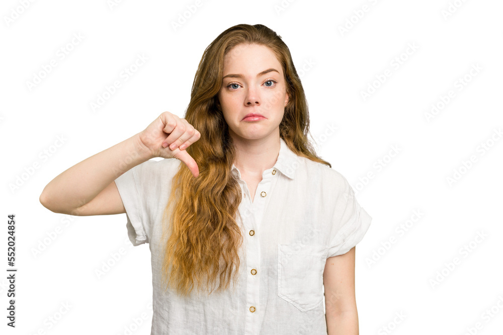 Young caucasian redhead woman isolated showing a dislike gesture, thumbs down. Disagreement concept. Young caucasian redhead woman isolated showing a dislike gesture, thumbs down. Disagreement concept.