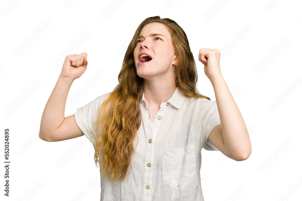 Obraz premium Young caucasian redhead woman isolated raising fist after a victory, winner concept.