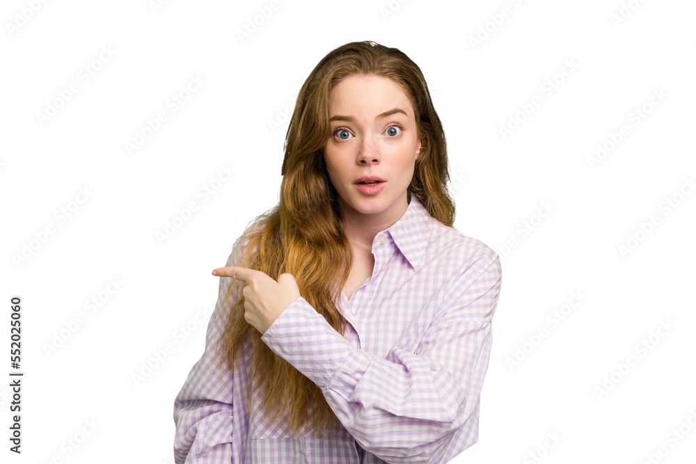 Young caucasian redhead woman isolated pointing to the side Young caucasian redhead woman isolated pointing to the side