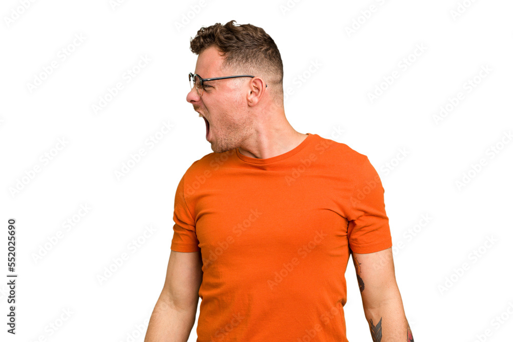 Obraz premium Young caucasian handsome man isolated shouting very angry, rage concept, frustrated.
