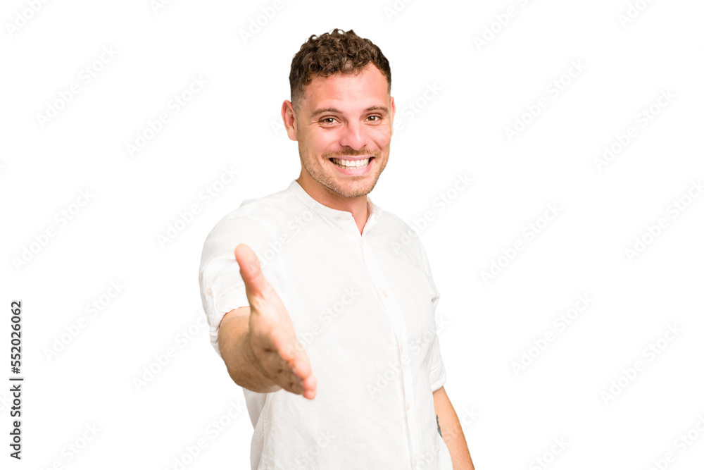 Young caucasian handsome man isolated stretching hand at camera in greeting gesture. Young caucasian handsome man isolated stretching hand at camera in greeting gesture.
