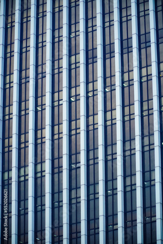 blue glass facade of skyscraper. building windows texture
