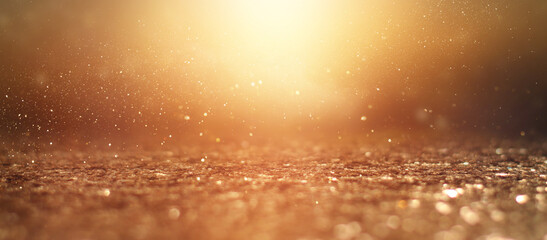 background of gold abstract glitter lights. de focused