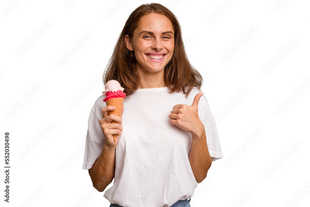 Young caucasian woman holding an ice cream isolated smiling and raising thumb up Young caucasian woman holding an ice cream isolated smiling and raising thumb up