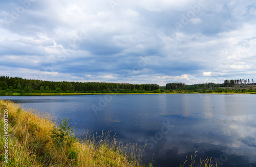 Fototapeta Naklejka Na Ścianę i Meble -  Hirschler pond near Clausthal-Zellerfeld in the Harz Mountains. Landscape with a small lake and idyllic nature.
