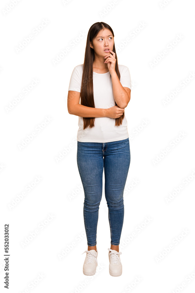 Young asian woman standing, full body cutout isolated looking sideways with doubtful and skeptical expression. Young asian woman standing, full body cutout isolated looking sideways with doubtful and skeptical expression.
