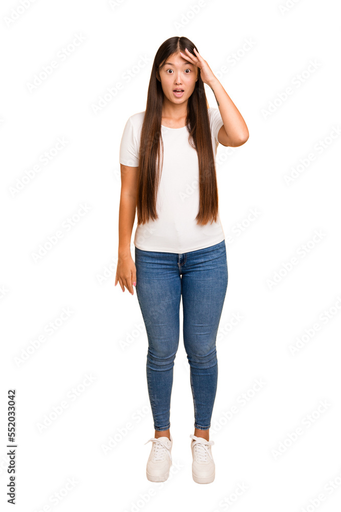 Young asian woman standing, full body cutout isolated shouts loud, keeps eyes opened and hands tense. Young asian woman standing, full body cutout isolated shouts loud, keeps eyes opened and hands tense.