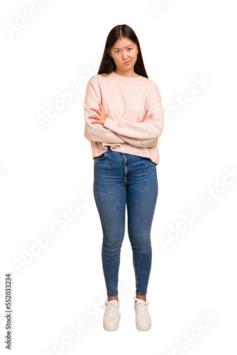 Young asian woman standing, full body cutout isolated unhappy looking in camera with sarcastic expression.