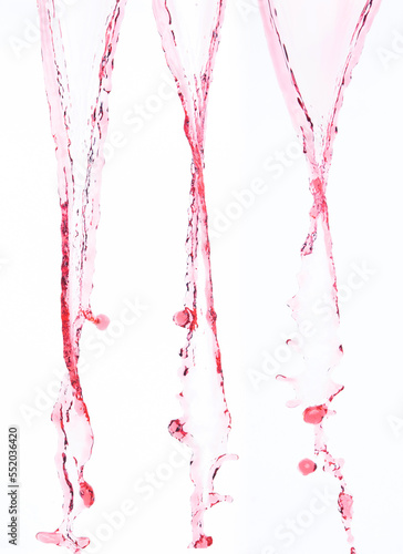 Red juice from splash in Air. Water red tomato pour from sky and purify clean natural. Wine shape form of water splashing flow celebrate over White background Isolated
