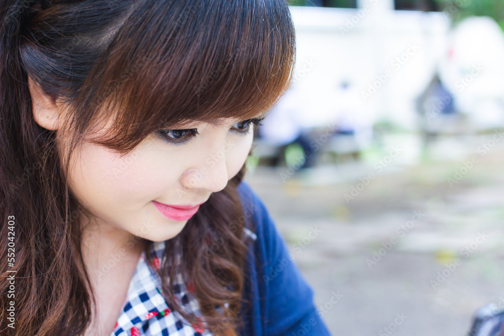 Asian woman doing makeup and smile happily. Asian woman doing makeup and smile happily.