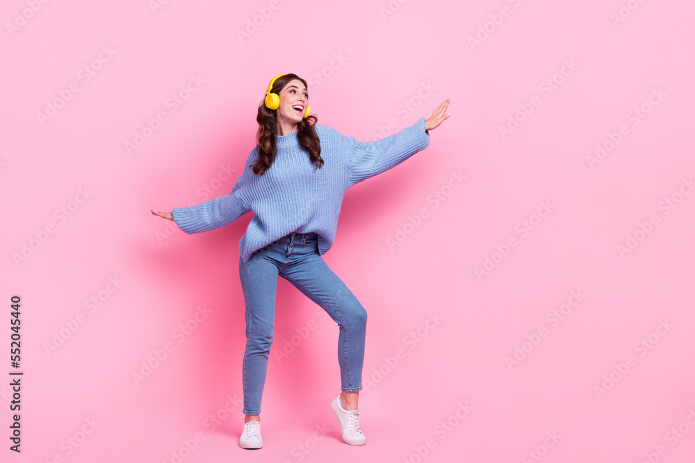 Full body portrait of overjoyed pretty lady chilling dance listen favorite song isolated on pink color background