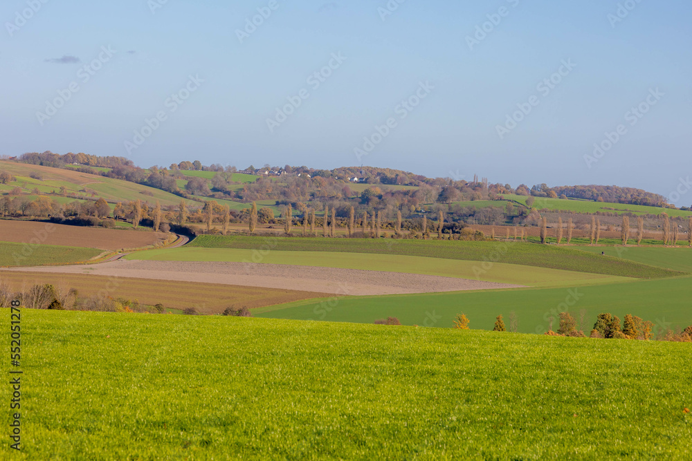 Fototapeta premium Autumn landscape of hilly countryside in Zuid-Limburg, Small houses on hillside with sunlight in the morning, Gulpen-Wittem is a villages in southern part of the Dutch province of Limburg, Netherlands