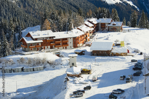 Snow-covered village - San Simone ski resort, Bergamo Alps, Italy photo