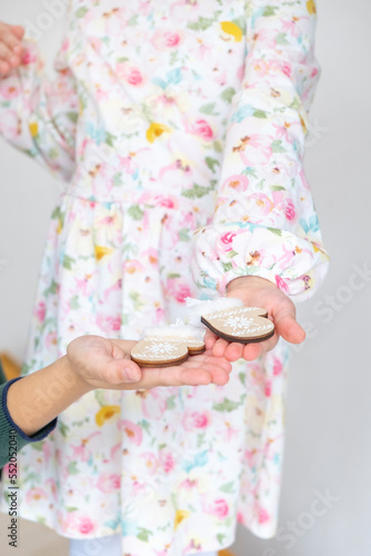 Children hold Christmas gingerbreads in hands © aleksashka_89