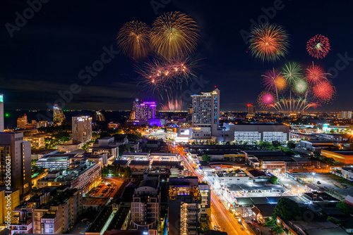Colorful Fireworks festival with city scape at night time.