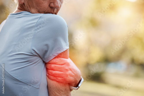 Fototapeta Naklejka Na Ścianę i Meble -  Senior woman and workout arm injury inflammation discomfort on outdoor walk, run or jog. Active retirement person on exercise break with pain from accident, aging or elderly arthritis.