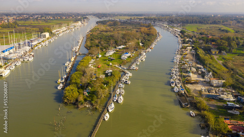 Aerial view on the Holy Isle located in Fiumicino, Italy. It' s an artificial island on the Tiber River, near Rome. Many boats are anchored. photo