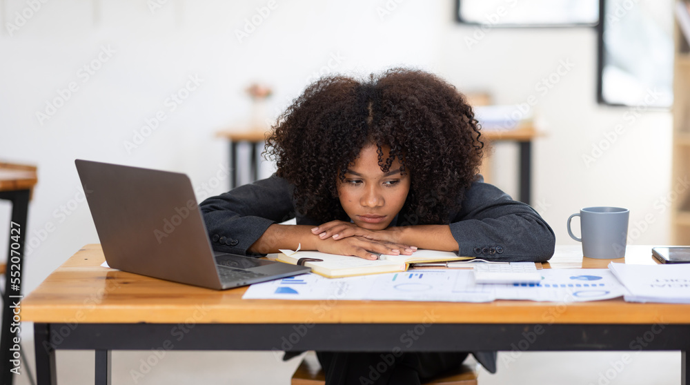 Feeling tired and stressed, workload, burnout and fatigue. Frustrated young african american woman keeping eyes closed and massaging nose after work at laptop for long time in office Feeling tired and stressed, workload, burnout and fatigue. Frustrated young african american woman keeping eyes closed and massaging nose after work at laptop for long time in office