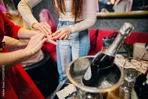 A bachelorette party game. The girls play with their hands. Team game. holiday