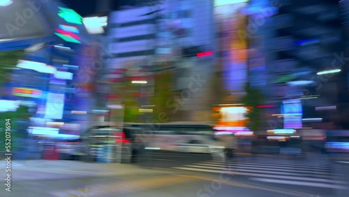 Hyperlapse of Tokyo Akihabara district, fast moving pedestrians in busy night street, asian nightlife and entertainment in Tokyo