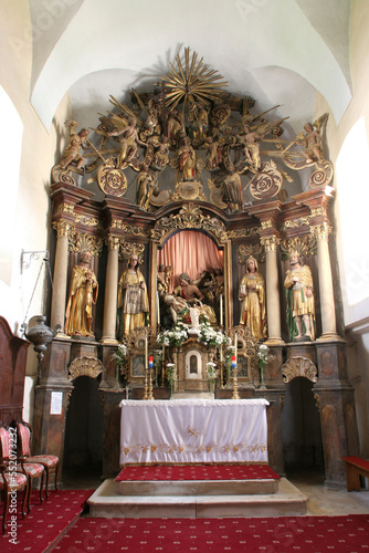 Main altar in the church of Saint Mary Magdalene in Cazma, Croatia photo