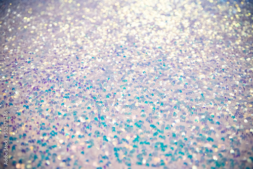 Sequins on Fabric, blue Beads, Sequins or Beads, Fashion Fabric. Holographic bright light blue glitter real texture background.