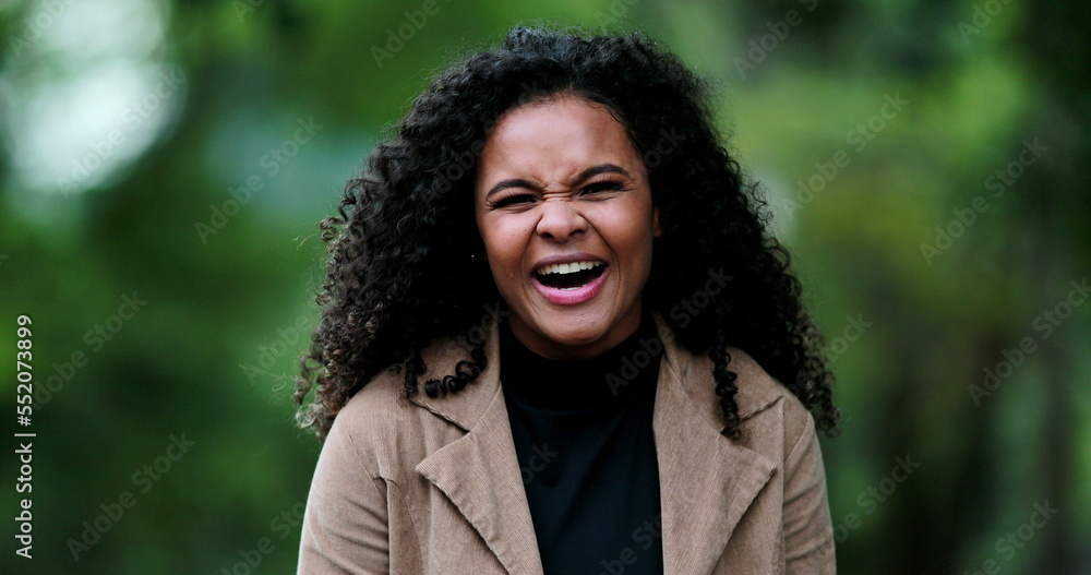 Positive happy black girl smiling and laughing outside Positive happy black girl smiling and laughing outside