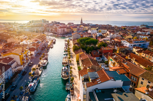 Town of Grado colorful architecture and channels aerial sunset view