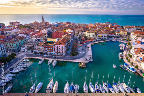 Obraz na płótnie Town of Grado colorful central channel harbor aerial sunset view w salonie