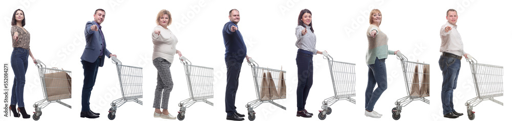 a group of people with a shopping cart point their finger at the camera a group of people with a shopping cart point their finger at the camera