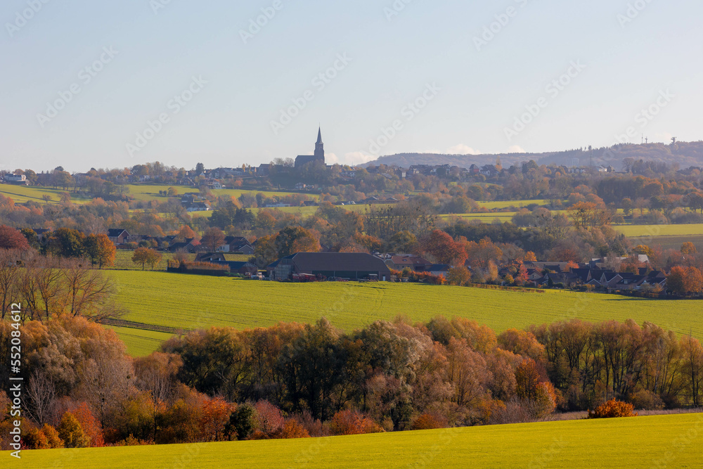 Autumn landscape of hilly countryside in Zuid-Limburg, Small houses on hillside with sunlight in the morning, Gulpen-Wittem is a villages in southern part of the Dutch province of Limburg, Netherlands