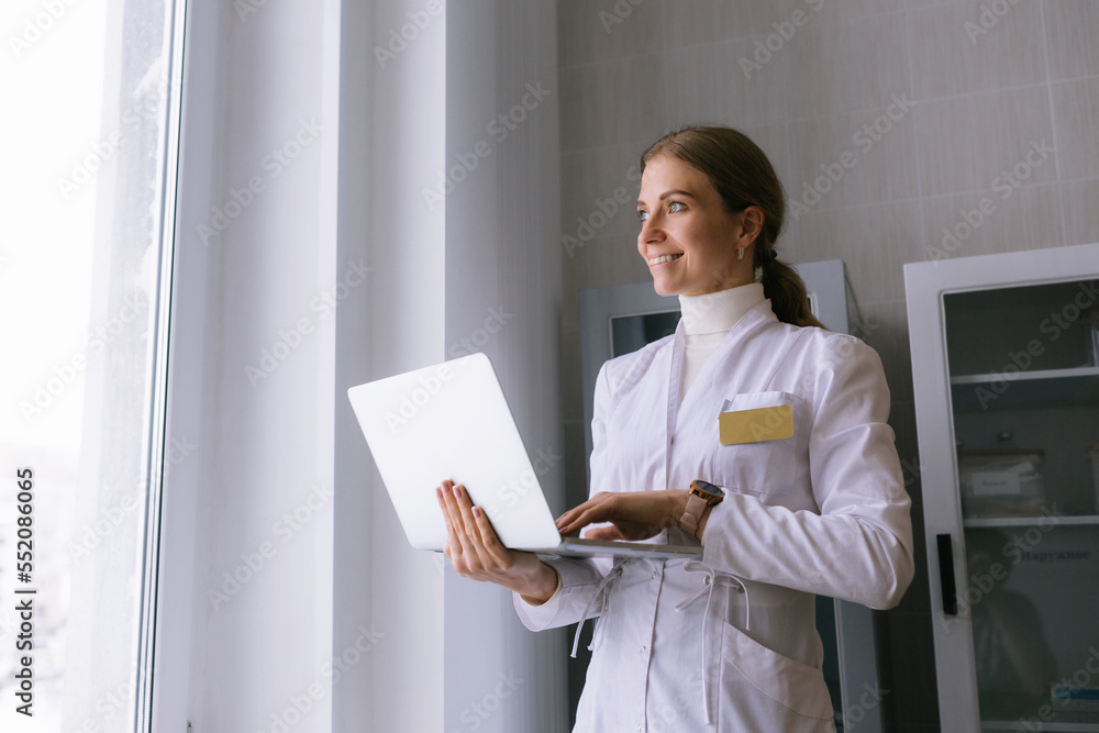 Young female doctor talking to patient online from medical office. Young female doctor talking to patient online from medical office.