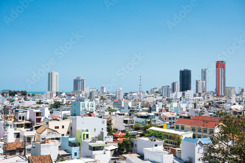 Crowded residential and high rise buildings in the city on bright day