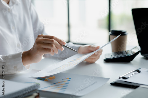 Business men are looking at the company s financial documents to analyze problems and find solutions before bringing the information to a meeting with a partner. Financial concept.