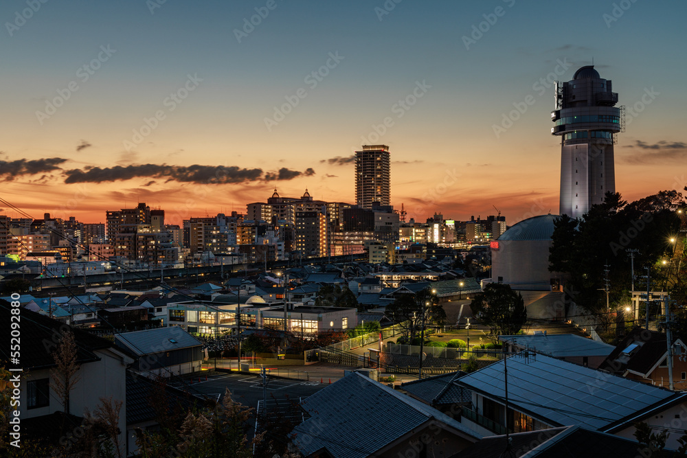 After sunset glow behind Akashi clocktower and city in early evening
