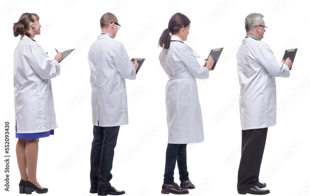 group of doctors standing with their backs isolated on white group of doctors standing with their backs isolated on white