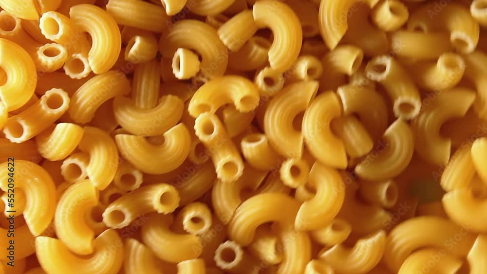 Uncooked Chifferi Rigati Pasta - Top View, Low Key. Fat and Unhealthy Food. Classic Dry Macaroni, Rotating Background. Italian Culture and Cuisine. Raw Golden Pasta Texture - Right Angular Rotation Uncooked Chifferi Rigati Pasta - Top View, Low Key. Fat and Unhealthy Food. Classic Dry Macaroni, Rotating Background. Italian Culture and Cuisine. Raw Golden Pasta Texture - Right Angular Rotation