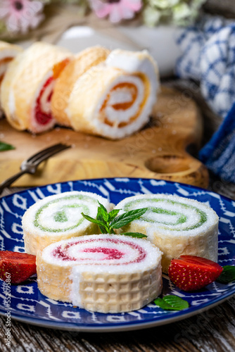 Slices of homemade sweet roll with fruit jam.