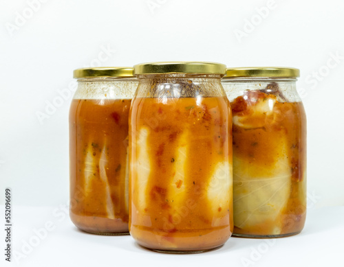 Stuffed cabbage in a jar with tomato sauce - concept of homemade preserves without background