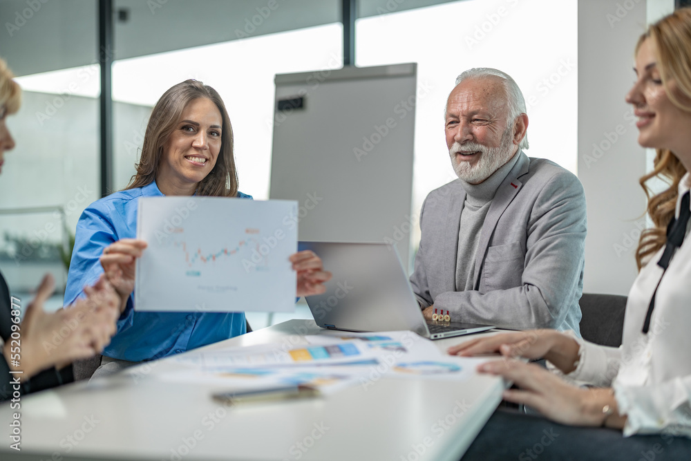 Group of business people on meeting, discussing with some chart examples
Group of business people on meeting, discussing with some chart examples