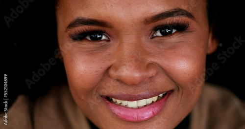 Young black woman portrait close-up face smiling. Happy African girl