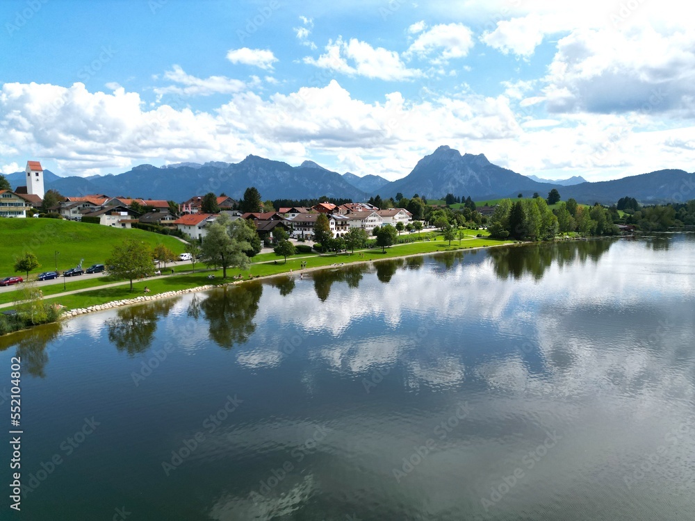 Hopfensee lake and town Hopenfen Swabia Bavaria Germany drone aerial view Hopfensee lake and town Hopenfen Swabia Bavaria Germany drone aerial view