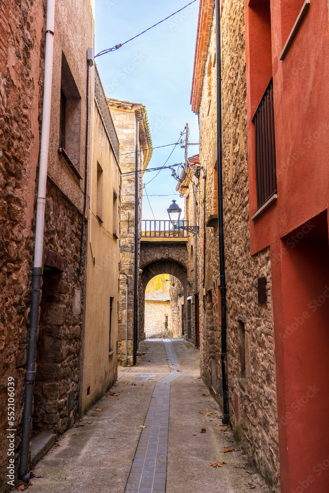 Vertical picture of ancient street in Albanyà town, a medieval village at Catalan Pyrenees in Girona, Spain