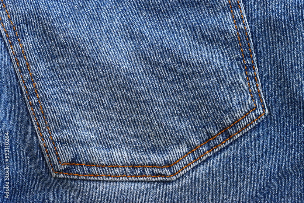 close up of worn blue jeans cloth fabric close up of worn blue jeans cloth fabric