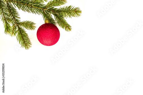 Christmas composition. Green fir tree branch and Xmas decoration on white background. Top view, flat lay. Copy space for text